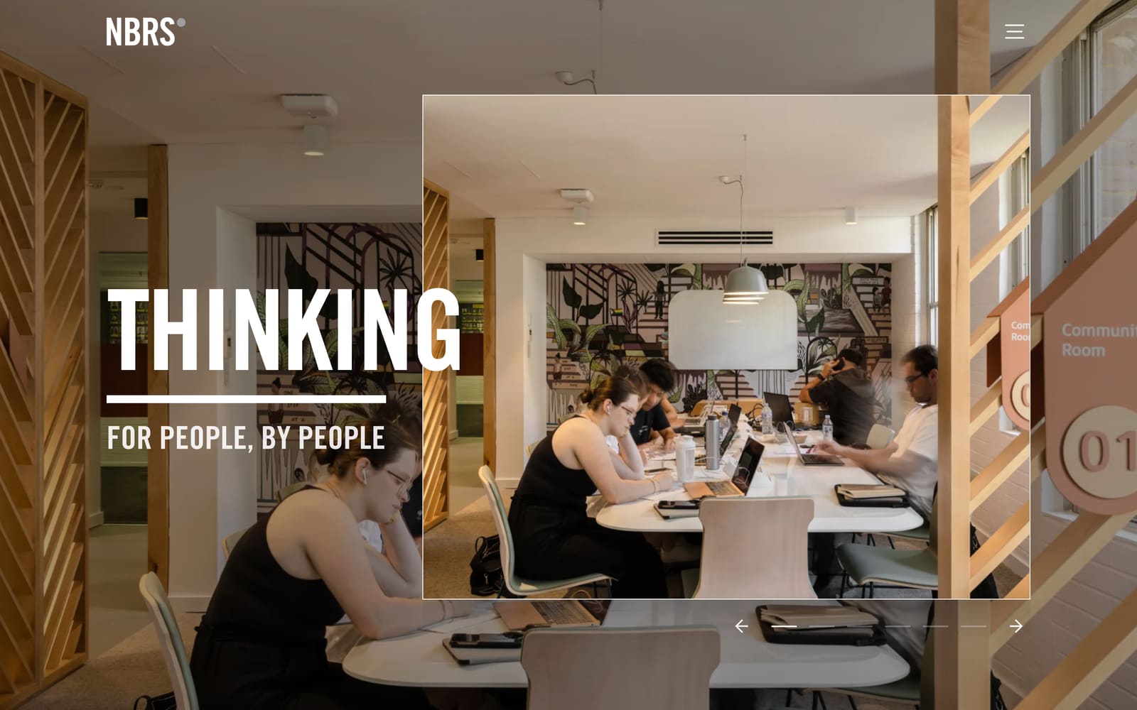 The new NBRS homepage: the words Thinking, for people, by people over a photo of students working in a community room